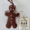 Hand-crocheted gingerbread man Christmas ornament with festive details and hanging loop