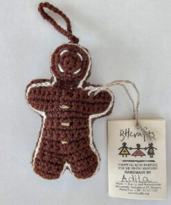 Hand-crocheted gingerbread man Christmas ornament with festive details and hanging loop