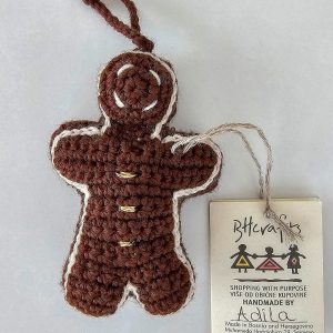 Hand-crocheted gingerbread man Christmas ornament with festive details and hanging loop