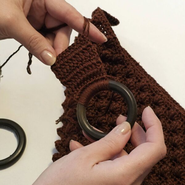 BHcrafts women artisan proudly displaying handmade products.