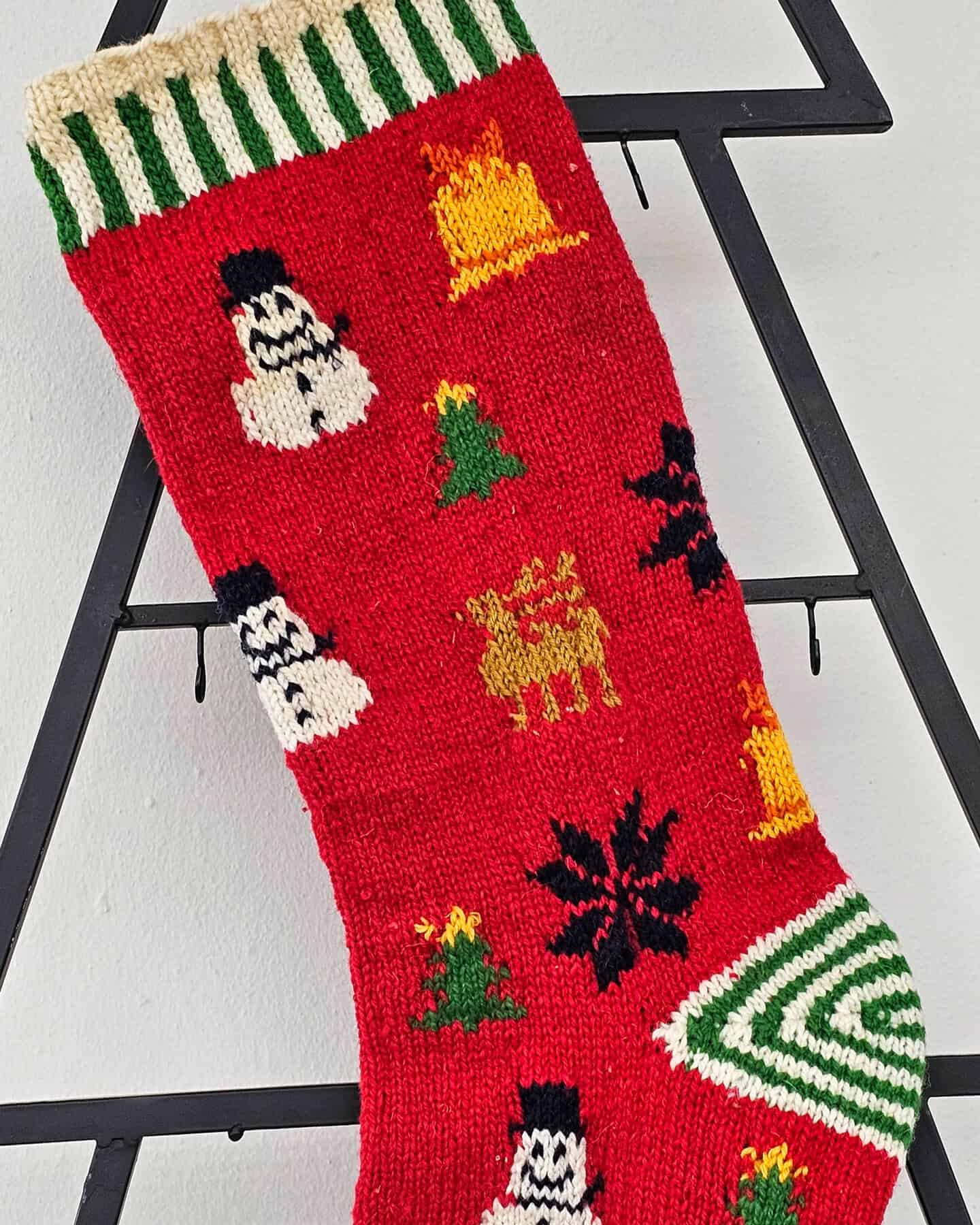 Fair Trade hand-knitted Christmas stocking in vibrant holiday colors with festive patterns
