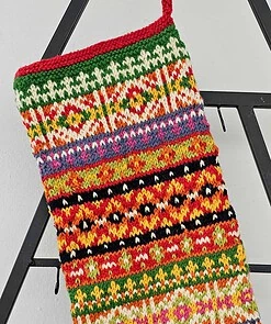 Gift-ready hand-knitted Christmas stocking in festive multicolor design