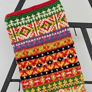 Gift-ready hand-knitted Christmas stocking in festive multicolor design