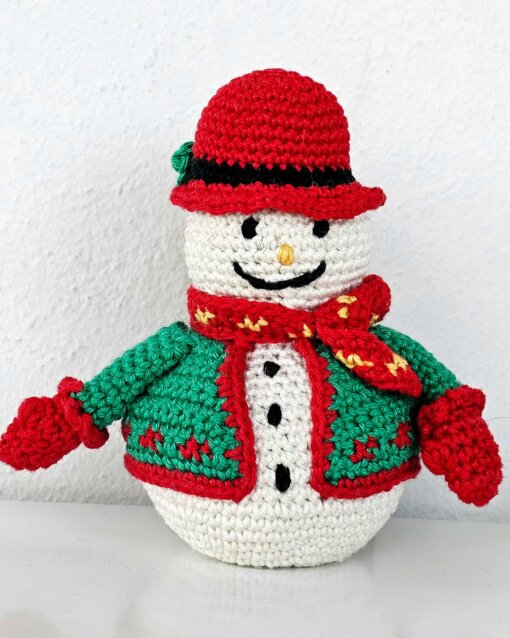 Hand-crocheted snowman doll in green jacket, red mittens and red hat