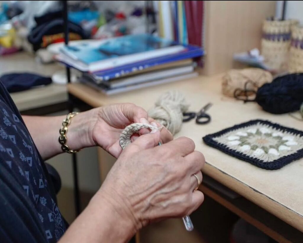 Women artisan hand crocheting for BHcrafts