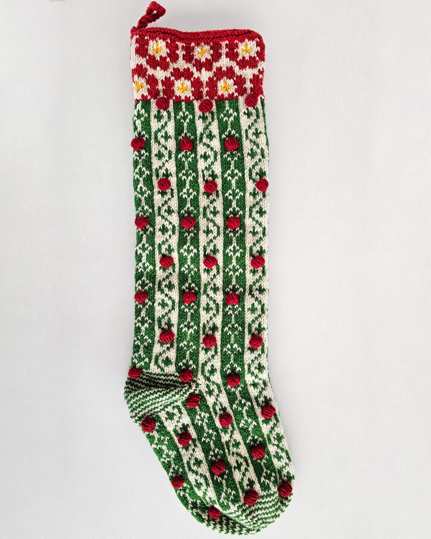 Handmade Christmas stocking WFTO certified knit red, green, white eco-friendly holiday decor