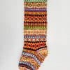 Handmade knit Christmas stocking with colorful traditional fair isle pattern