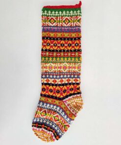 Handmade knit Christmas stocking with colorful traditional fair isle pattern