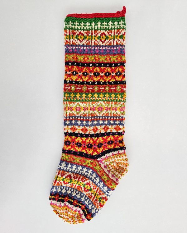 Handmade knit Christmas stocking with colorful traditional fair isle pattern