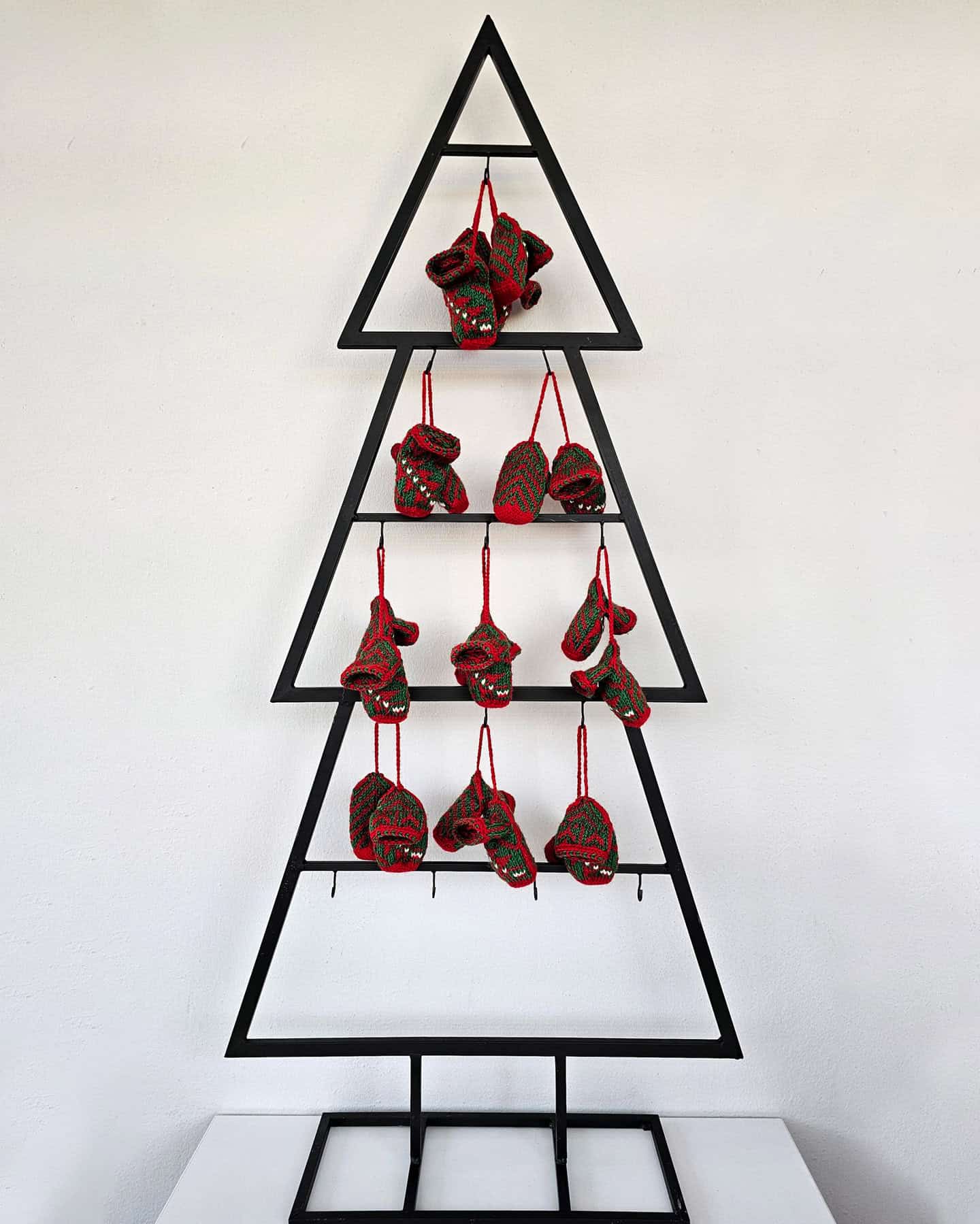 Cozy hand-knit socks for your Christmas tree.