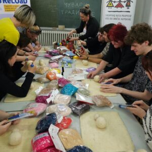 Passing cultural knowledge from mentors to students.