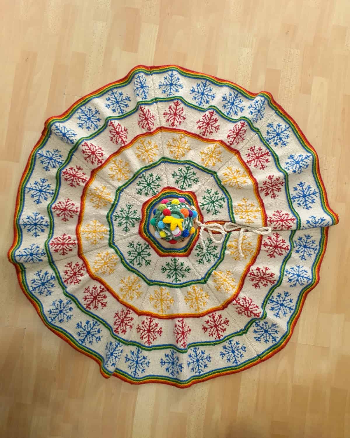 Artisan-Made Hand-knit Fair Trade Christmas tree skirt with colorful snowflake pattern
