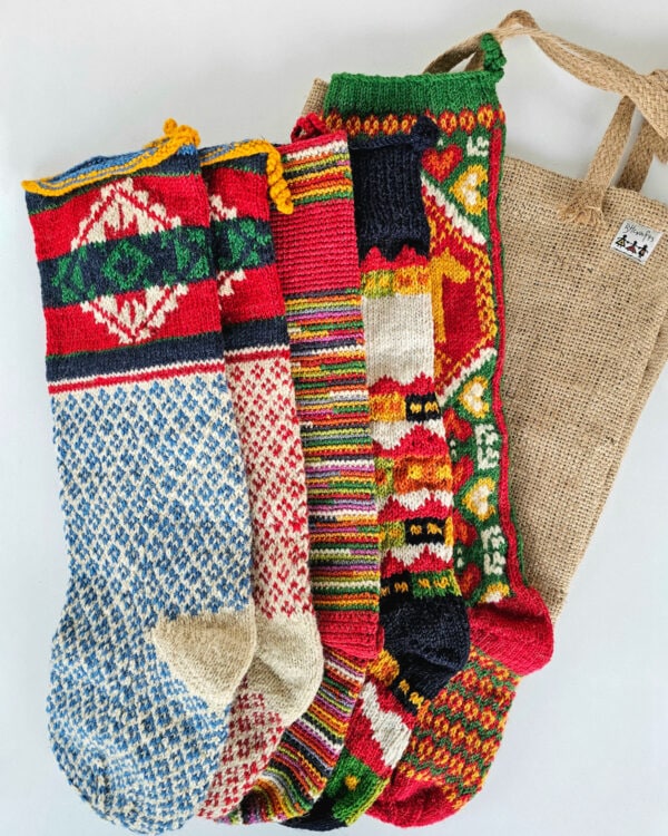 Set of five colorful hand-knitted Christmas stockings crafted by BHcrafts artisans