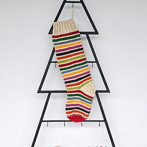 Knitted Christmas stocking with colorful stripes for your holiday décor