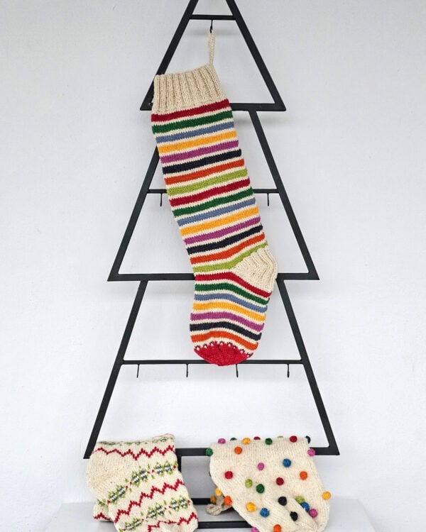 Knitted Christmas stocking with colorful stripes for your holiday décor