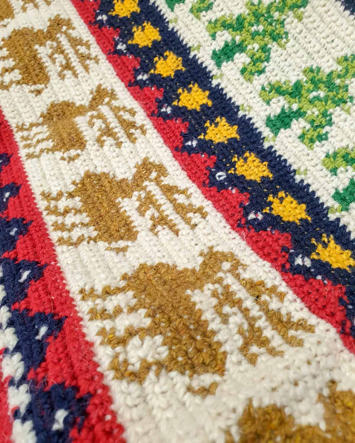 Close-up of Fair Trade crocheted Christmas blanket handmade by BHcrafts artisans for your holiday joy