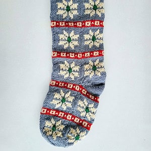 Unique knitted holiday stocking with loop for hanging