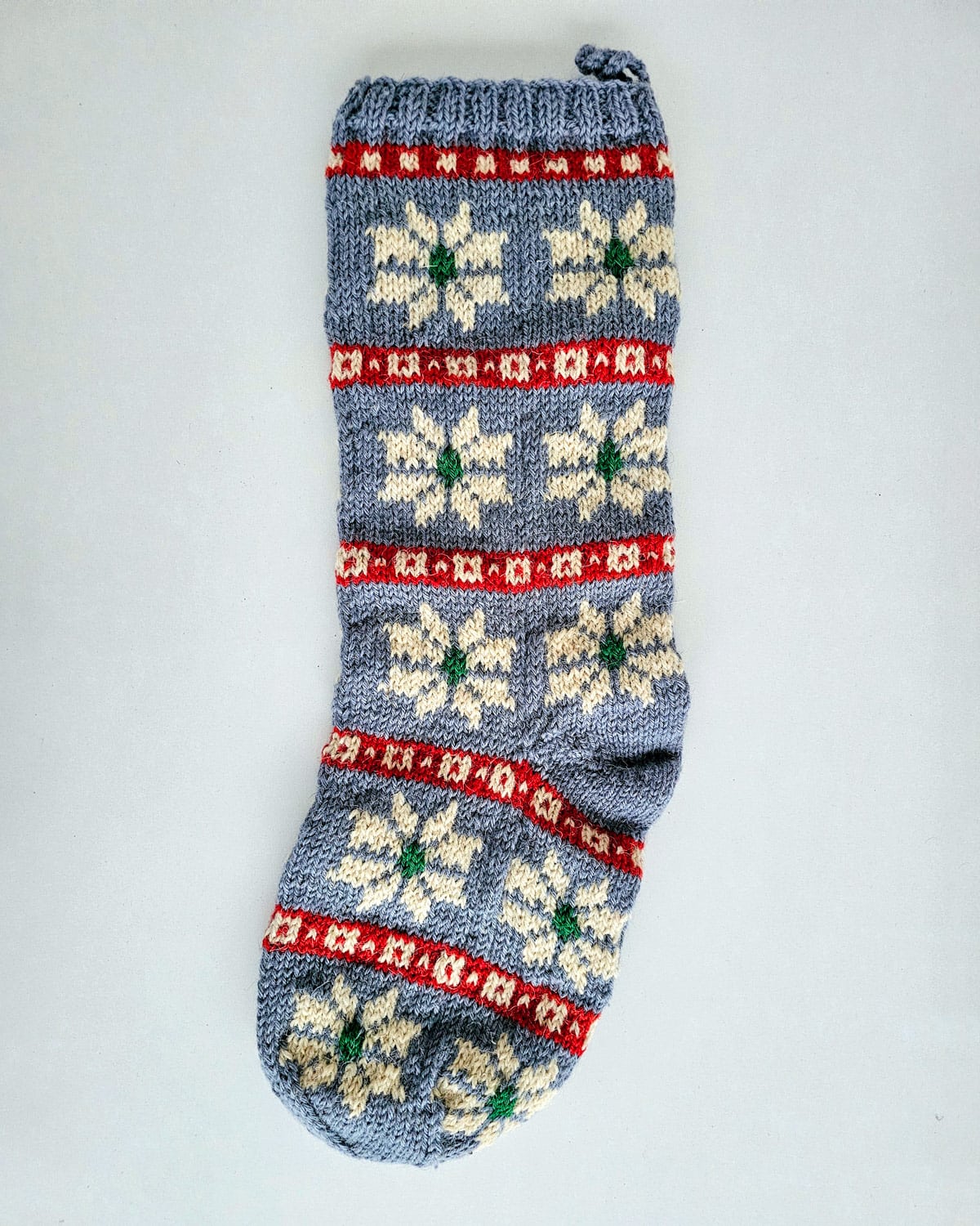 Unique knitted holiday stocking with loop for hanging
