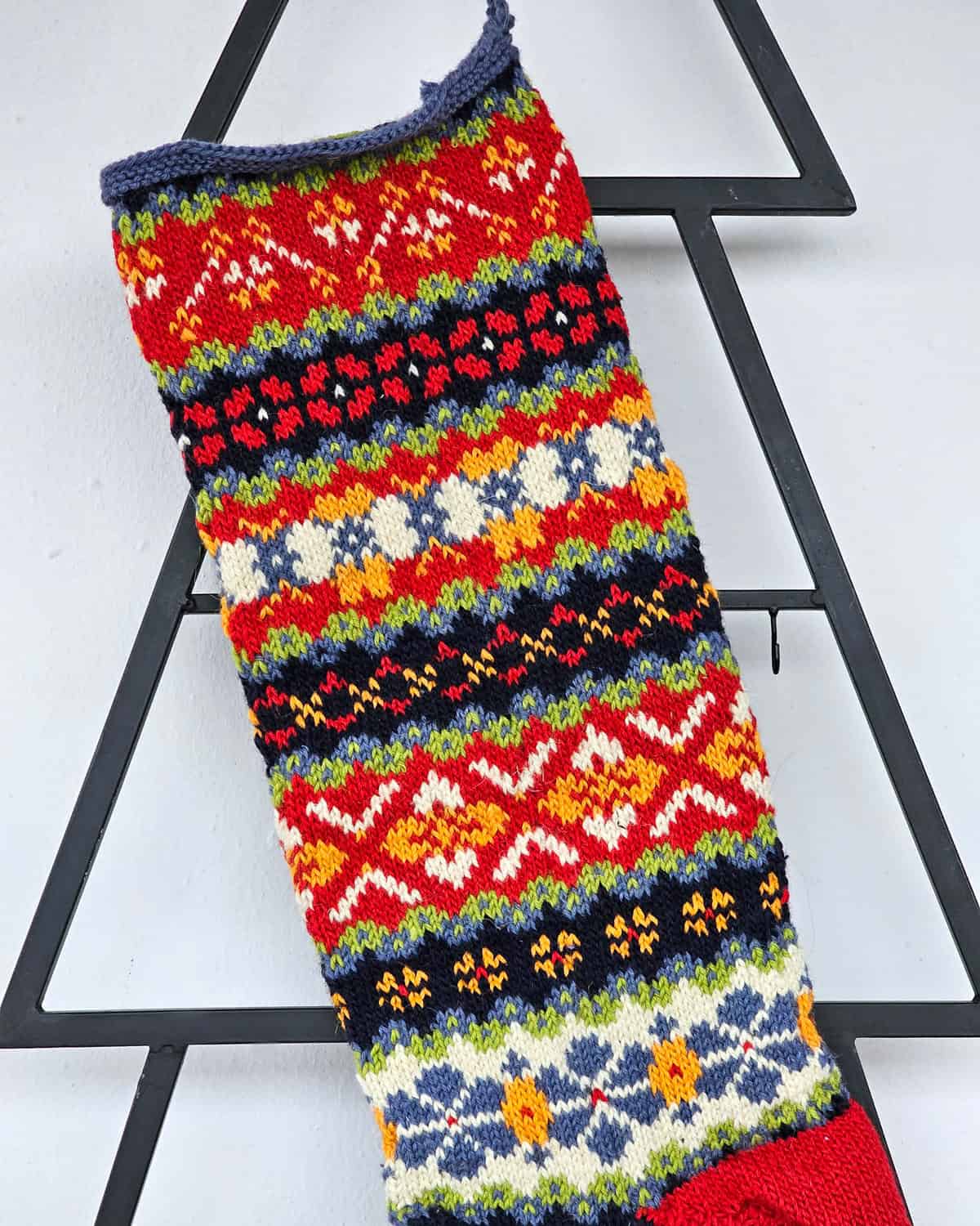 Fair Trade hand-knitted Holiday stocking in red with multicolor jacquard design