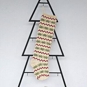 Hand-knit Christmas tree stocking with chevron (zigzag) pattern