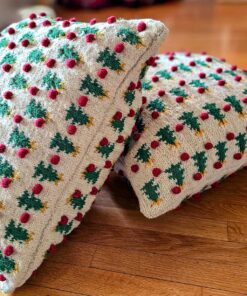 Two fair trade handmade Christmas pillows with matching tree and pom-pom designs