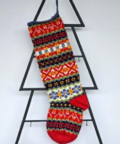 Handmade Christmas tree stocking with colorful Fair Isle pattern in red, green, blue, and yellow