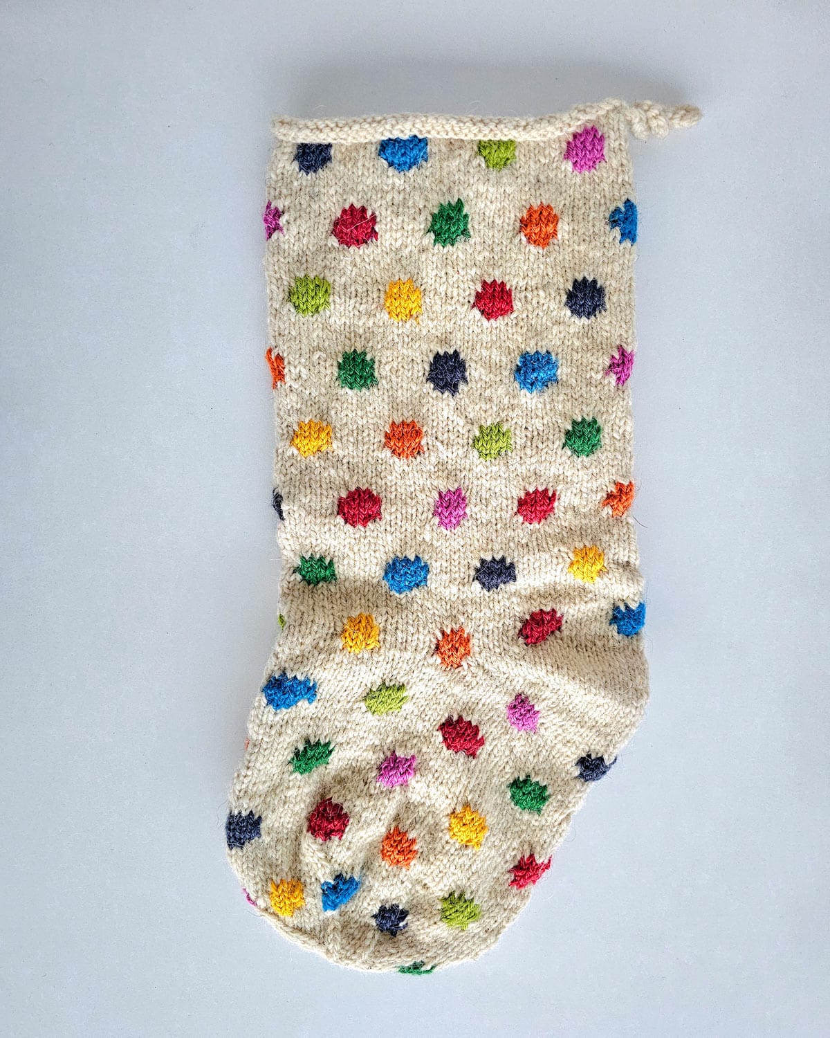 Handmade Fair Trade White Christmas stockings in a festive collection of textures and colors