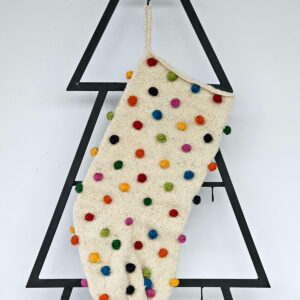 Hand-knit holiday stocking with multicolor pom-poms. Limited edition Christmas tree stocking