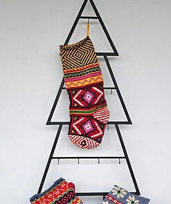 Hand-knit Christmas stocking with colorful geometric patterns and hanging loop