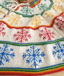 Close-up of hand-knit Christmas tree skirt snowflake pattern