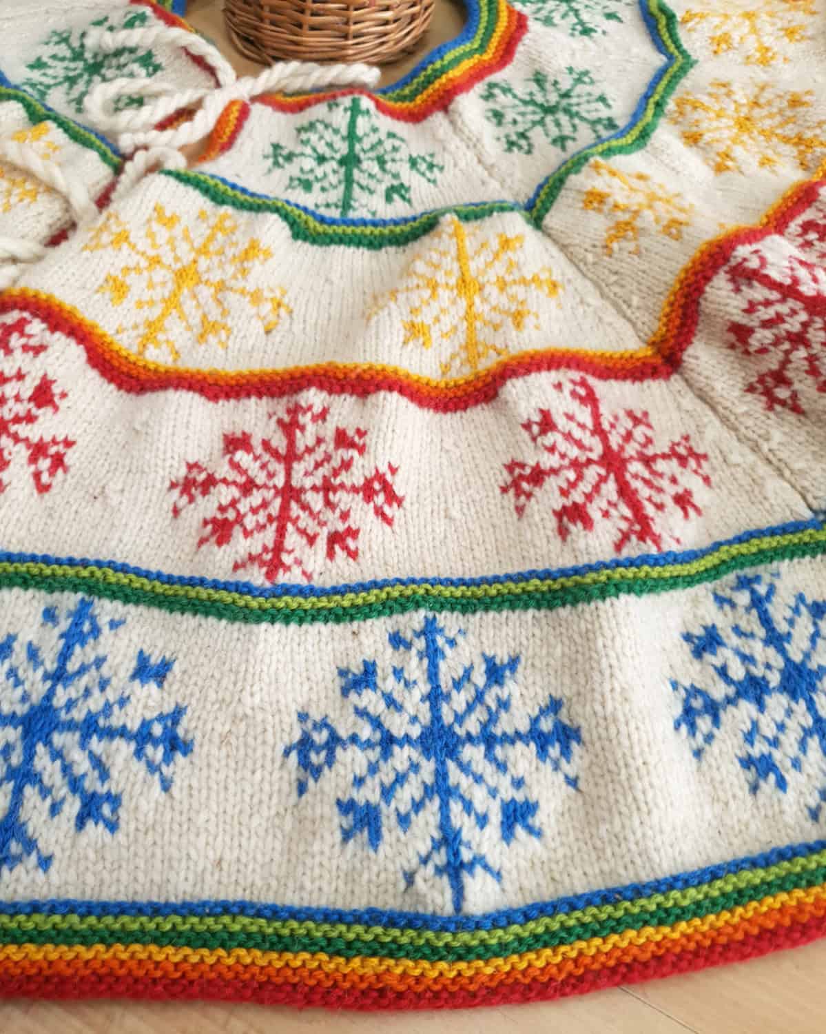 Close-up of hand-knit Christmas tree skirt snowflake pattern