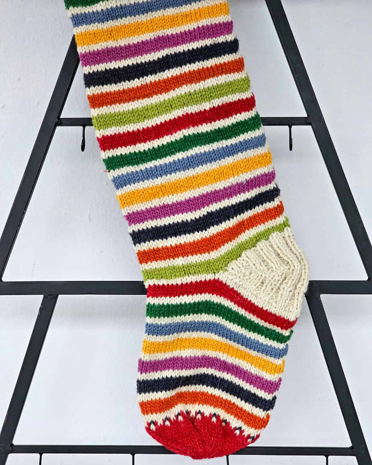 Bright striped holiday stocking for Christmas joy