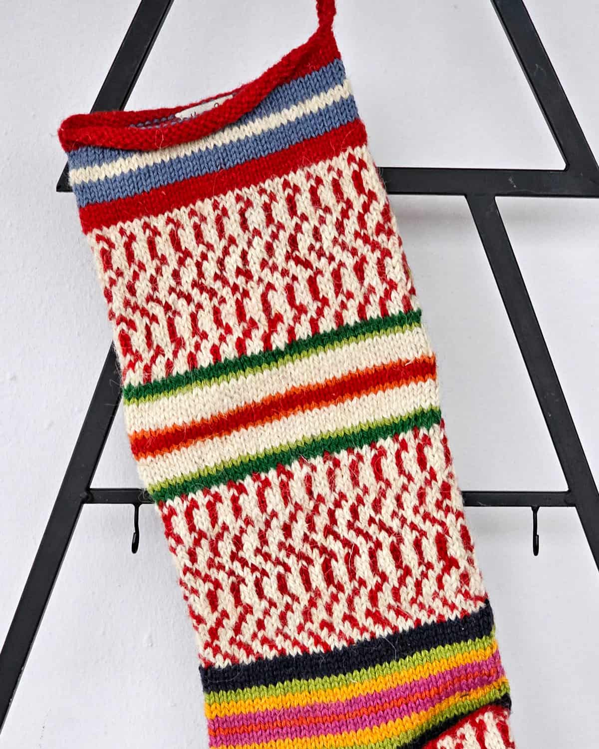 Traditional holiday stocking with colorful striped design