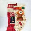 Handmade Christmas stockings set with girl doll appliqués made by BHcrafts artisans