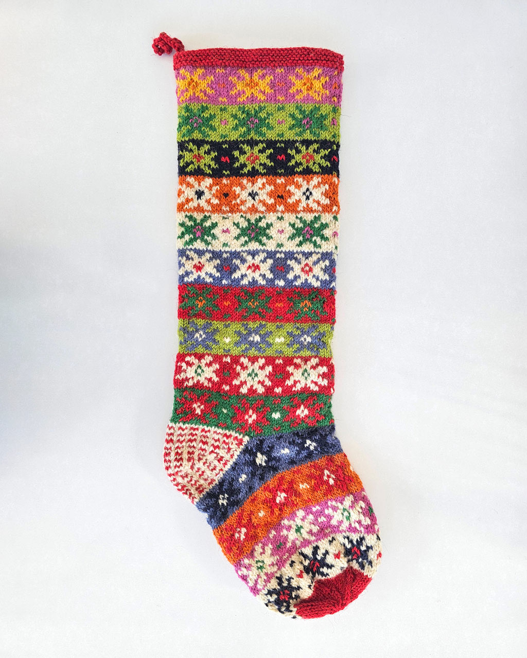 Colorful handmade Christmas stockings crafted by artisan