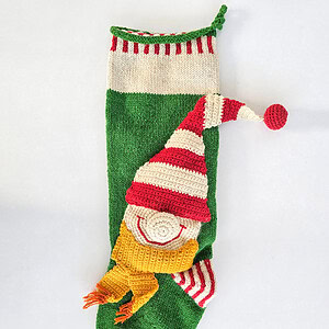 Knitted holiday stockings with textured elf character designs