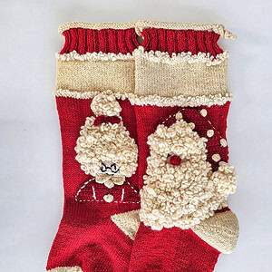Red Fair Trade handmade Christmas stockings with Santa and Mrs. Claus design