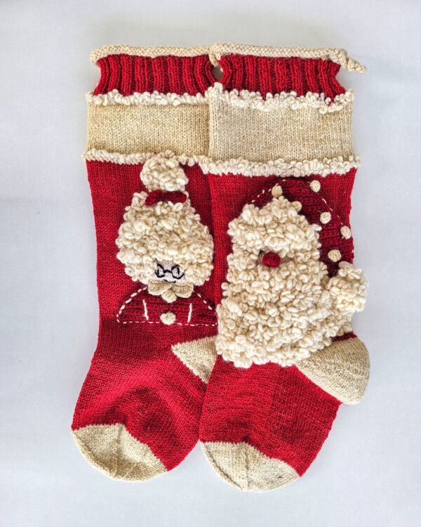 Red Fair Trade handmade Christmas stockings with Santa and Mrs. Claus design