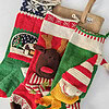 Handmade Christmas stockings with reindeer, elf, and snowball