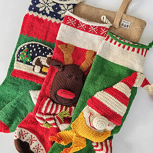 Handmade Christmas stockings with reindeer, elf, and snowball