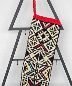 Hand knitted holiday stocking made of natural wool