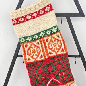 Fair-trade Christmas stocking featuring customizable name area and mixed knit motifs.