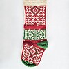 Hand-knitted Fair Trade Christmas stocking in red, green, and cream with traditional pattern.