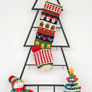 Fair-trade Christmas stocking featuring Santa, gifts, and bells in multicolor design.
