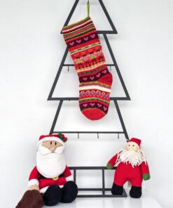 Hand knit Christmas stocking with colorful stripes and heart motifs, artisan made