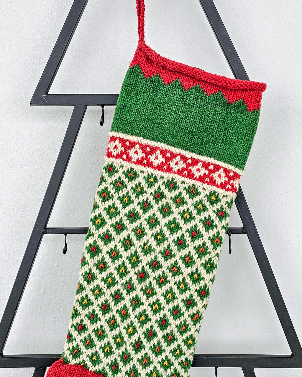 Green Christmas stocking with red cuff, heel, and toe; hand knit personalized holiday stockings