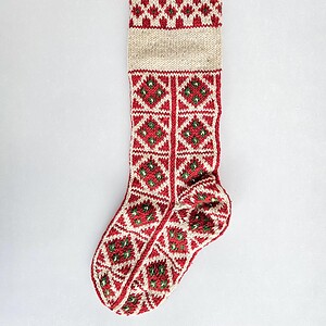 Red and green knit Christmas stocking with custom name