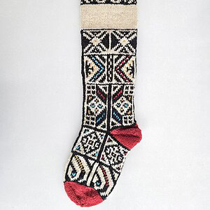 Fair-trade jacquard pattern Christmas stocking with customizable name and red accents. Make your holiday home decor unique