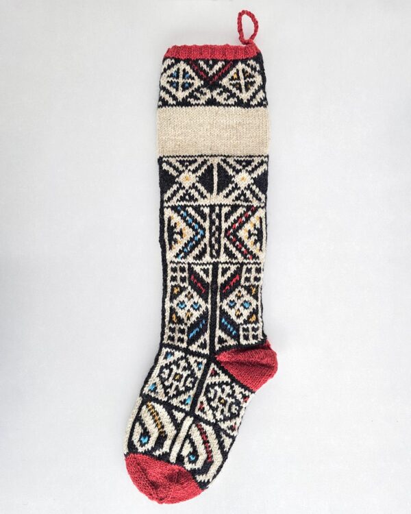 Fair-trade jacquard pattern Christmas stocking with customizable name and red accents. Make your holiday home decor unique