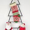Hand-knitted multicolor traditional Christmas stocking with rich pattern.